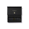 Kinetic Perfumes Discovery Set 11 × 2 ml – geöffnete schwarze Box mit zehn Probenfläschchen und Goldschrift auf Weiss