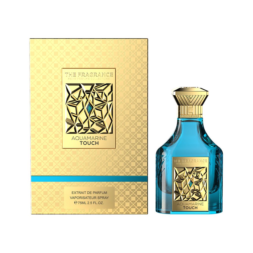 The Fragrance Aquamarine Touch Extrait de Parfum 75 ml – türkisfarbener Flakon rechts neben frontaler goldener Box mit türkisem Streifen