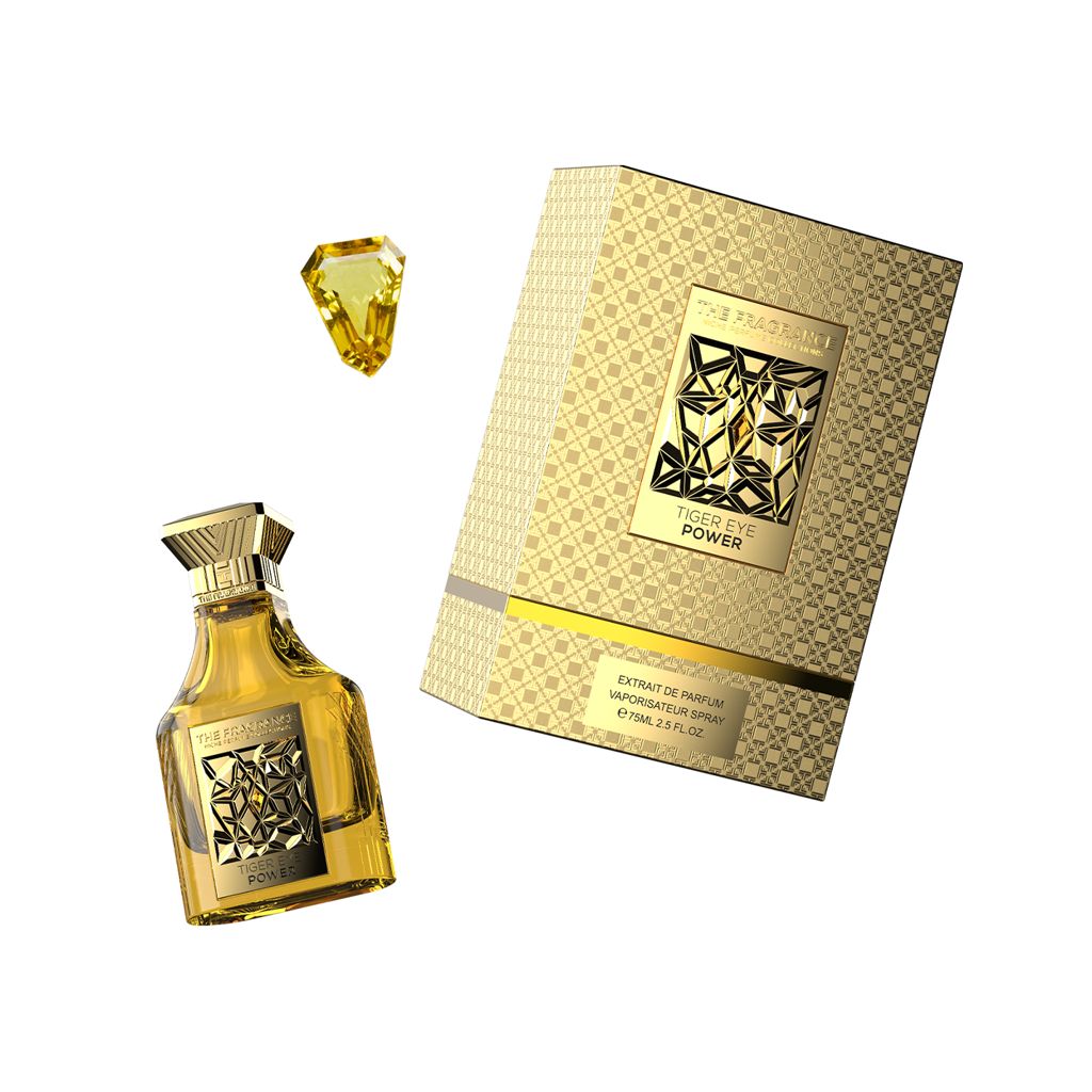 The Fragrance Tiger Eye Power Extrait de Parfum 75 ml – goldgelber Flakon schräg neben gelbem Edelstein und goldener Box