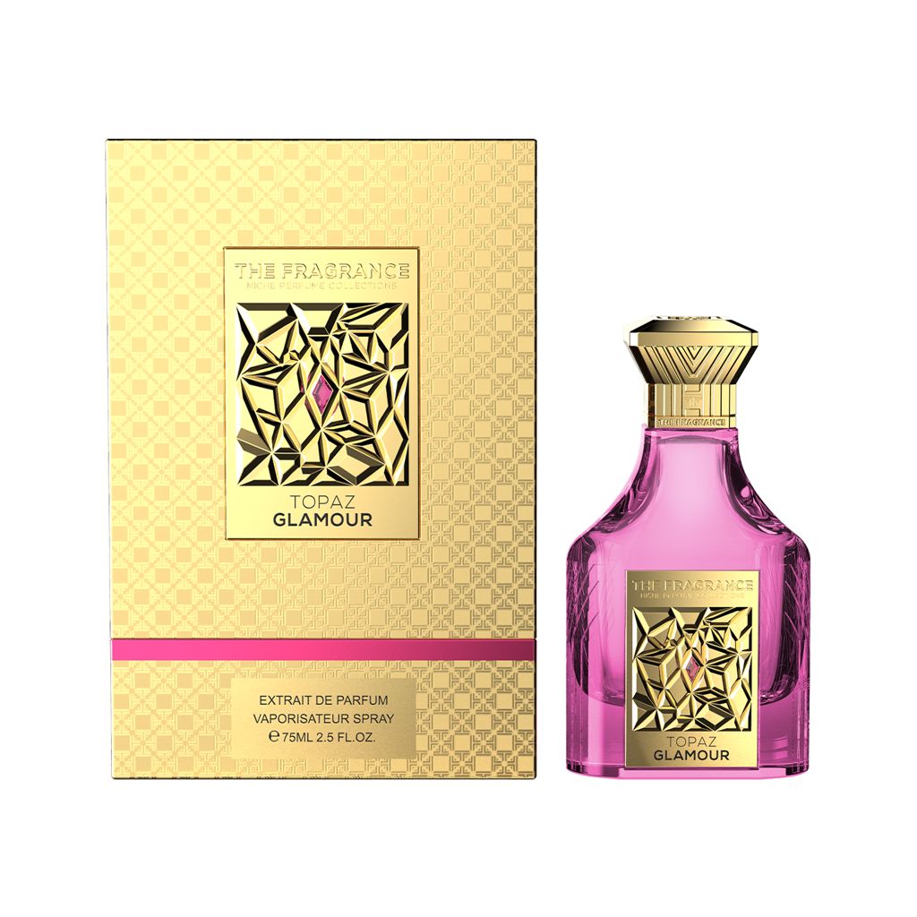 The Fragrance Topaz Glamour Extrait de Parfum 75 ml – pinker Flakon rechts neben frontaler goldener Box mit pinkem Streifen