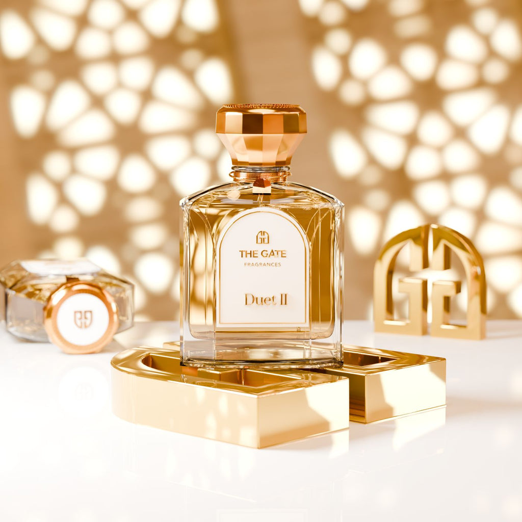 The Gate Duet II Extrait de Parfum 100 ml – pfirsichfarbener Flakon mit roségoldener Kappe auf goldenen Logo-Buchstaben