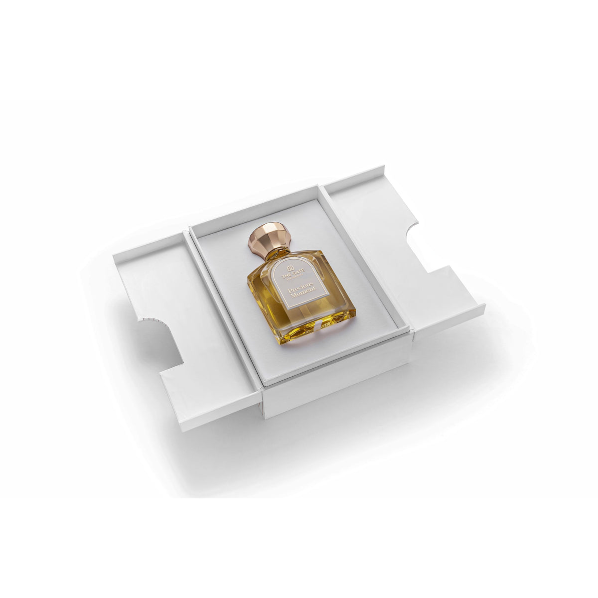The Gate Precious Moment Extrait de Parfum 100 ml – geöffnete weisse Präsentationsbox mit hellgoldenem Flakon