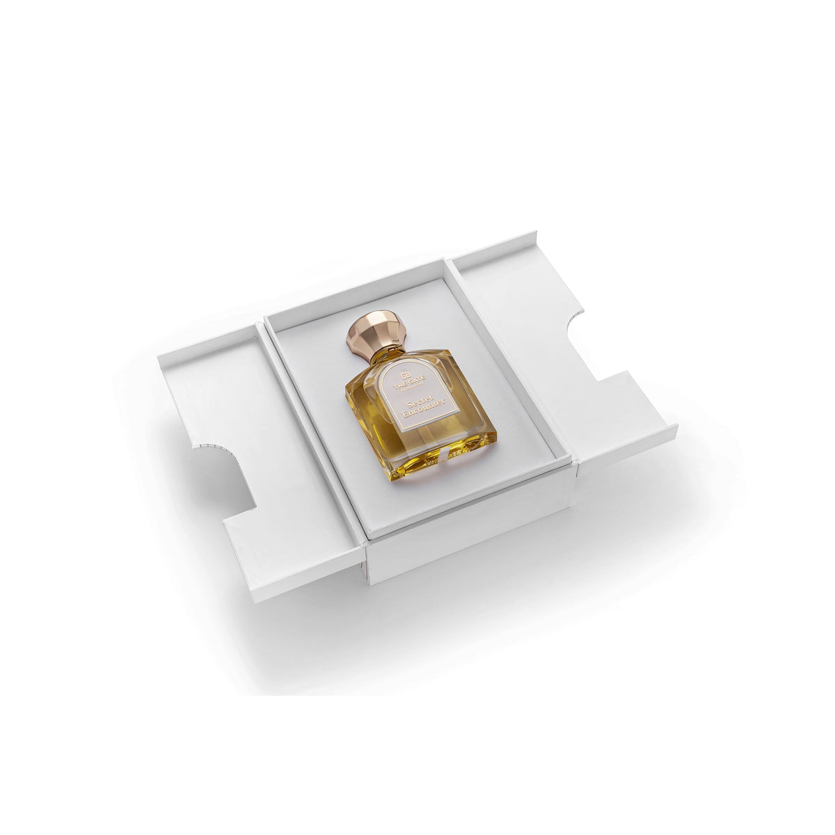 The Gate Secret Encounter Extrait de Parfum 100 ml – geöffnete weisse Präsentationsbox mit hellgoldenem Flakon